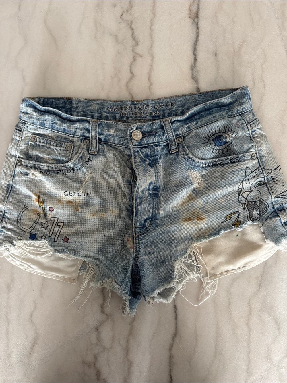 American Eagle Outfitters Light Blue Denim Distressed Graphic Cutoff Shorts